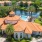 a body of water surrounded by buildings with terracotta roofd