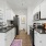 a kitchen with white cabinets