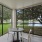 a table and chairs in screened in patio