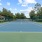 a tennis court with a fence