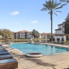 swimming pool with lounge chairs around it